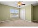 Carpeted bedroom with closet and window overlooking the water for ample natural light at 121 Parmelee Dr. # D, Murrells Inlet, SC 29576