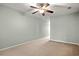 Neutral bedroom features carpet, a ceiling fan, and a window that provides natural light at 121 Parmelee Dr. # D, Murrells Inlet, SC 29576