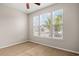 Bright bedroom featuring natural light through three windows at 121 Parmelee Dr. # D, Murrells Inlet, SC 29576