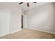 Neutral bedroom featuring a ceiling fan and a closet with paneled doors at 121 Parmelee Dr. # D, Murrells Inlet, SC 29576