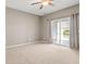 Bedroom with sliding glass doors to a patio and water views at 121 Parmelee Dr. # D, Murrells Inlet, SC 29576