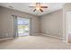 Bedroom with sliding glass doors to a deck overlooking a scenic pond at 121 Parmelee Dr. # D, Murrells Inlet, SC 29576