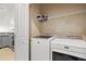 Functional laundry room with a modern washer and dryer, ample storage, and easy access from the kitchen at 121 Parmelee Dr. # D, Murrells Inlet, SC 29576