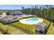 Beautiful community pool with lounge area surrounded by a black fence and well-manicured lawn at 121 Parmelee Dr. # D, Murrells Inlet, SC 29576