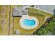 Aerial view of the community pool with seating and a surrounding fence and landscaping at 121 Parmelee Dr. # D, Murrells Inlet, SC 29576