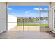 Peaceful screened porch showcasing serene water views, with comfortable space for relaxation and entertaining at 121 Parmelee Dr. # D, Murrells Inlet, SC 29576