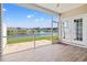 Relaxing screened porch offering stunning water views and providing a peaceful outdoor living space at 121 Parmelee Dr. # D, Murrells Inlet, SC 29576