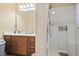 A bathroom featuring a wooden vanity with a sink and a shower with a clear glass door at 1222 Midtown Village Dr., Conway, SC 29526