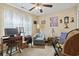 Cozy bedroom featuring a comfortable chair, desk, and bright natural light at 1222 Midtown Village Dr., Conway, SC 29526