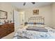 Bedroom featuring a ceiling fan and a view to a wood dresser and doorway at 1222 Midtown Village Dr., Conway, SC 29526
