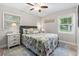 This bright bedroom features a comfortable bed with side tables and bright natural light at 1223 Naylor Ave., Myrtle Beach, SC 29577
