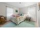 Cozy bedroom with coastal decor, comfortable bed, and natural light from two windows at 1223 Naylor Ave., Myrtle Beach, SC 29577