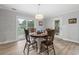 Cozy dining area with wood table, natural lighting, and a sliding door to the outside at 1223 Naylor Ave., Myrtle Beach, SC 29577
