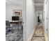 Hallway leading to a home office with a desk, computer, and comfortable gray chair at 1223 Naylor Ave., Myrtle Beach, SC 29577