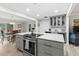 Open kitchen with marble island, modern appliances, and view of dining area at 1223 Naylor Ave., Myrtle Beach, SC 29577