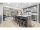 Kitchen island with marble countertops, bar stool seating, and views to the living area at 1223 Naylor Ave., Myrtle Beach, SC 29577