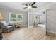 Living room with natural light, neutral paint, wood look floors, and a ceiling fan at 1223 Naylor Ave., Myrtle Beach, SC 29577