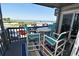 Relax on the balcony with table and chairs, overlooking breathtaking ocean views at 1310 N Waccamaw Dr. # 102, Garden City Beach, SC 29576