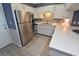 Modern kitchen with stainless steel appliances and white cabinets at 1310 N Waccamaw Dr. # 102, Garden City Beach, SC 29576