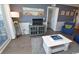 Bright living room with neutral decor and a view of the outside from the window at 1310 N Waccamaw Dr. # 102, Garden City Beach, SC 29576