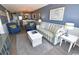 Open floor plan living room with dining area and kitchen in the background at 1310 N Waccamaw Dr. # 102, Garden City Beach, SC 29576