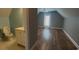 Bathroom with a toilet and a sink next to a bedroom with wood flooring at 1410 Bohicket Ct., Myrtle Beach, SC 29579