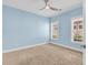 Bedroom with carpet and a ceiling fan under a light blue ceiling at 1410 Bohicket Ct., Myrtle Beach, SC 29579