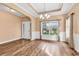 Elegant dining room with hardwood floors, a chandelier, and large window at 1410 Bohicket Ct., Myrtle Beach, SC 29579