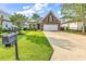 Charming brick home with a well-manicured lawn and a two-car garage at 1410 Bohicket Ct., Myrtle Beach, SC 29579