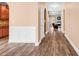 Inviting hallway showcasing beautiful hardwood floors and wainscoting detail at 1410 Bohicket Ct., Myrtle Beach, SC 29579