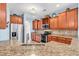 Bright kitchen features granite countertops, stainless steel appliances, and wooden cabinets at 1410 Bohicket Ct., Myrtle Beach, SC 29579