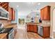 Bright kitchen with granite counters, wood cabinets, and stainless appliances at 1410 Bohicket Ct., Myrtle Beach, SC 29579