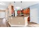 Open-concept kitchen with breakfast bar, wood cabinets and stainless appliances at 1410 Bohicket Ct., Myrtle Beach, SC 29579
