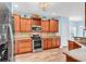 Well-equipped kitchen featuring stainless steel appliances and wood cabinetry at 1410 Bohicket Ct., Myrtle Beach, SC 29579