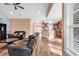 Open-concept living room and kitchen area with wood flooring and neutral tones at 1410 Bohicket Ct., Myrtle Beach, SC 29579