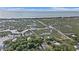 Aerial view of waterway with a beach, houses, trees and a clear blue sky at 157 Egret Run Ln. # 523, Pawleys Island, SC 29585