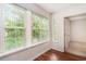 Bedroom with hardwood floors, white trim, windows with blinds and natural light at 157 Egret Run Ln. # 523, Pawleys Island, SC 29585