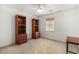 Bedroom with neutral carpet, natural light, built-in bookshelves, and desk at 157 Egret Run Ln. # 523, Pawleys Island, SC 29585