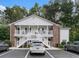 Charming condo featuring white siding, brick accents, and inviting double porches at 157 Egret Run Ln. # 523, Pawleys Island, SC 29585