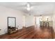 Open living area with hardwood floors, ceiling fan and view into the kitchen area at 157 Egret Run Ln. # 523, Pawleys Island, SC 29585