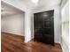 Cozy living space featuring a dark wood armoire and hardwood flooring at 157 Egret Run Ln. # 523, Pawleys Island, SC 29585