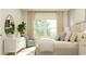 Comfortable main bedroom with a stylish bed, soft textures, and natural light at 1704 Hunting Harris Ct # 1, Ocean Isle Beach, NC 28469
