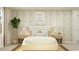 This bedroom is light and bright with neutral decor, ample natural light, side tables with lamps, and a calming effect at 1708 Hunting Harris Ct # 2, Ocean Isle Beach, NC 28469