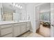 Bathroom leading into the bedroom, featuring a large mirror and vanity at 172 Ella Kinley Circle # 101, Myrtle Beach, SC 29588