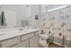 Well-lit bathroom with a single sink vanity, decorative shower curtain and neutral color palette at 172 Ella Kinley Circle # 101, Myrtle Beach, SC 29588