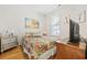 Bright bedroom featuring a floral bedspread, stylish decor, and natural light at 172 Ella Kinley Circle # 101, Myrtle Beach, SC 29588