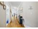 Bright hallway with hardwood floors, with views of the kitchen and the laundry area at 172 Ella Kinley Circle # 101, Myrtle Beach, SC 29588