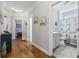 Hallway with hardwood floors leading to a full bathroom at 172 Ella Kinley Circle # 101, Myrtle Beach, SC 29588