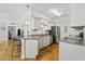 Cozy kitchen featuring stainless steel appliances, granite countertops and white cabinets at 172 Ella Kinley Circle # 101, Myrtle Beach, SC 29588