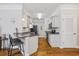Charming kitchen featuring granite countertops, stainless steel appliances, and hardwood floors at 172 Ella Kinley Circle # 101, Myrtle Beach, SC 29588